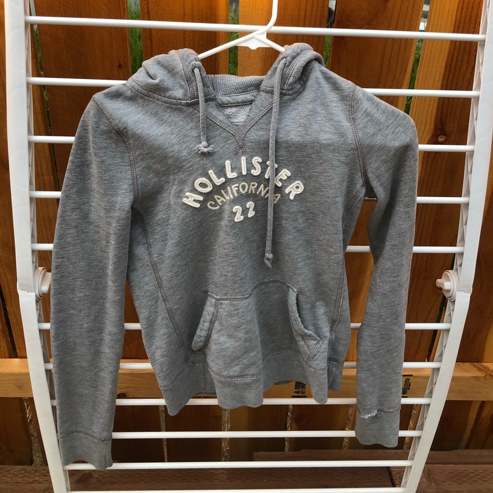 Gray Hollister sweatshirt.
